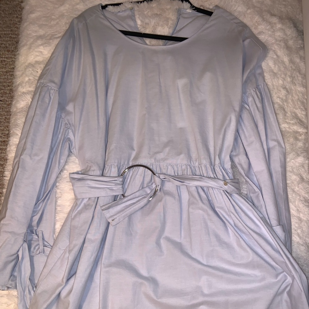 Light blue dress with tie on sleeves and belt.